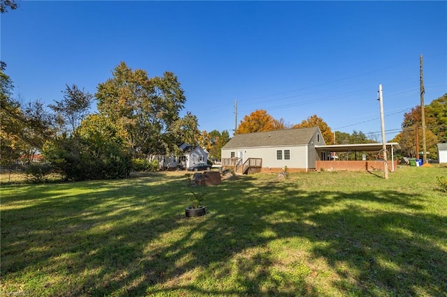 view of yard with a carport