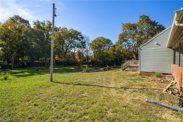 view of yard featuring a wooden deck