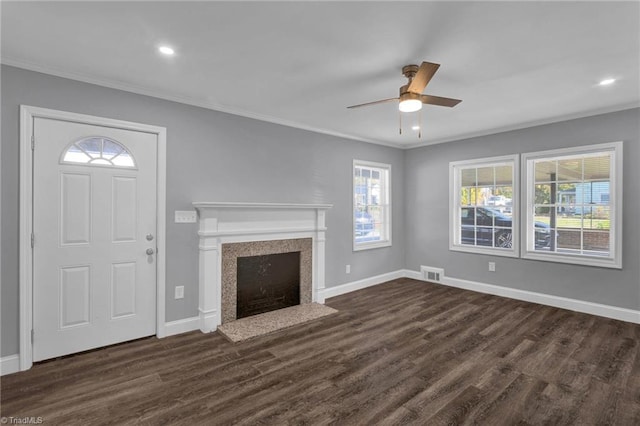 unfurnished living room featuring ornamental molding, dark hardwood / wood-style floors, and ceiling fan