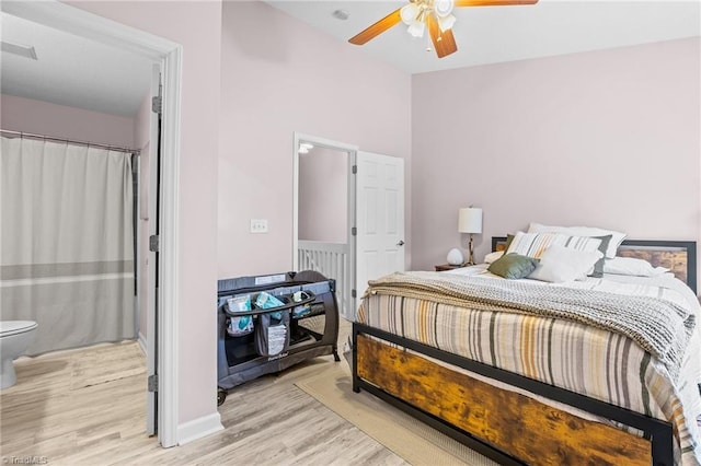 bedroom with ceiling fan and light wood-type flooring