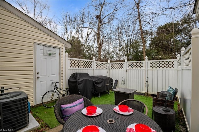 view of patio featuring a grill and central AC