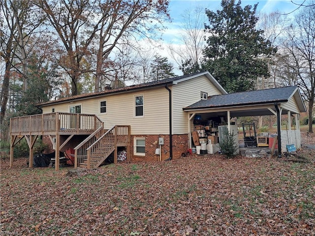 rear view of house with a wooden deck