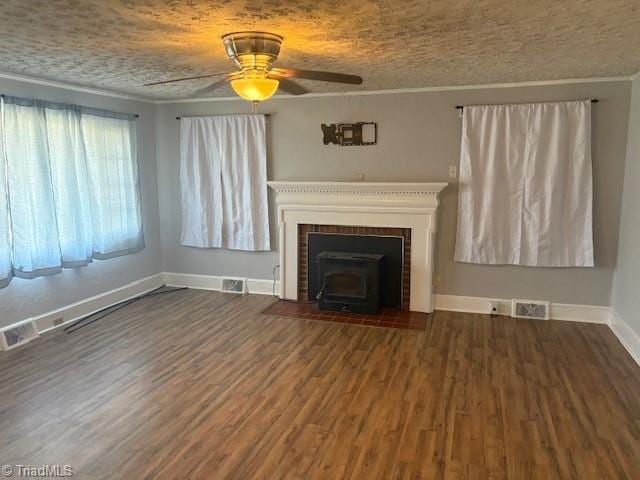 unfurnished living room with dark hardwood / wood-style floors, ceiling fan, crown molding, and a textured ceiling