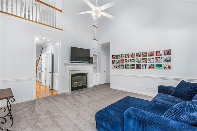 8300 Trottington Rd, Stokesdale, NC 27357 - carpeted living area featuring a high ceiling, ceiling fan, and a high end fireplace