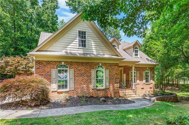8300 Trottington Rd, Stokesdale, NC 27357 - view of front of property with brick siding, roof with shingles, and a front lawn