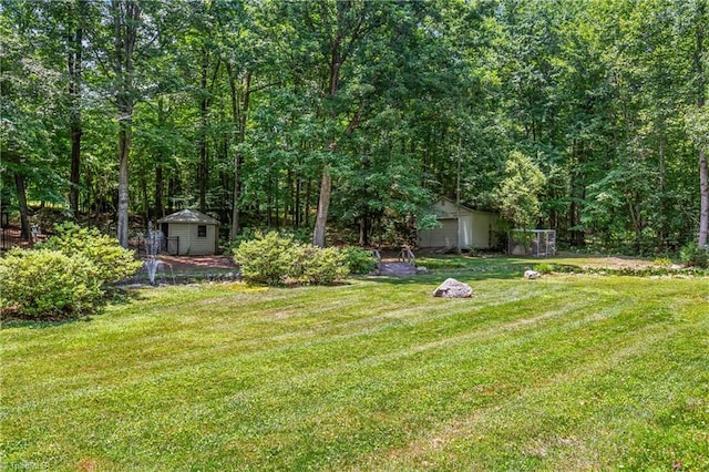 8300 Trottington Rd, Stokesdale, NC 27357 - view of grassy yard with a storage shed