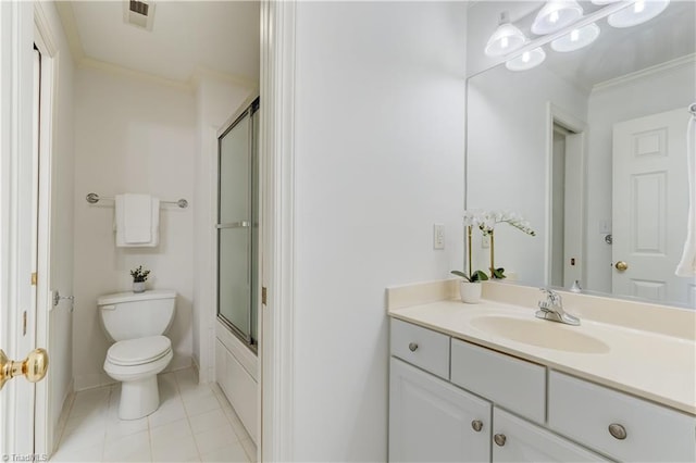 full bathroom featuring vanity, toilet, tile patterned flooring, and ornamental molding