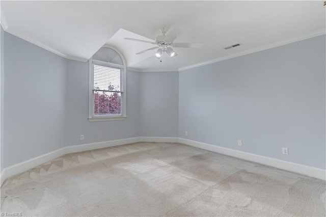 empty room with light carpet, ceiling fan, and ornamental molding