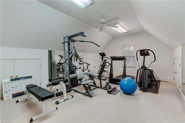 exercise room featuring ceiling fan, carpet floors, and vaulted ceiling