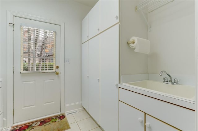 bathroom featuring tile patterned floors and vanity