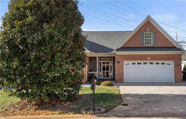 view of front of house with a garage, concrete driveway, brick siding, and roof with shingles