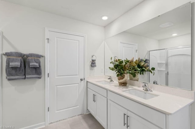 bathroom featuring vanity and an enclosed shower