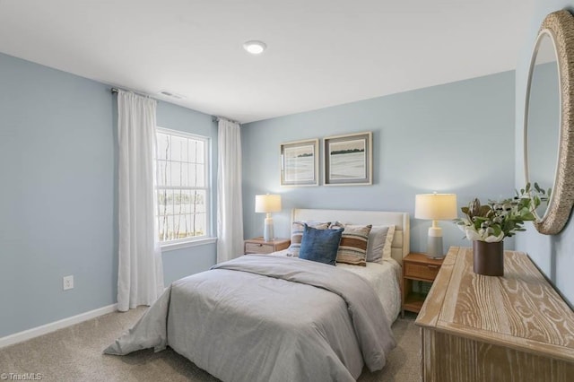 bedroom with light colored carpet