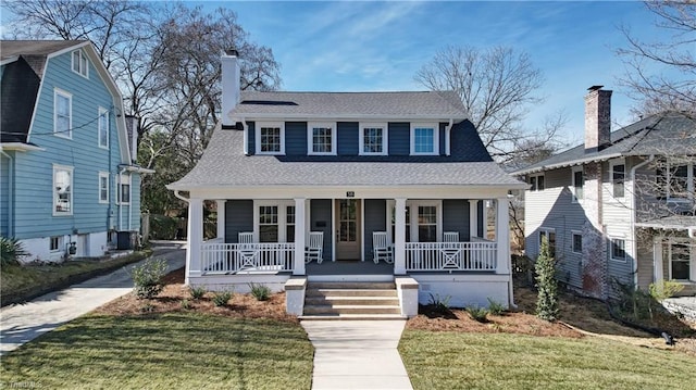 view of front of house with a front lawn and a porch