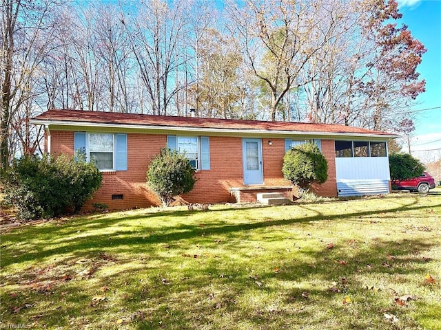 ranch-style house with a front yard