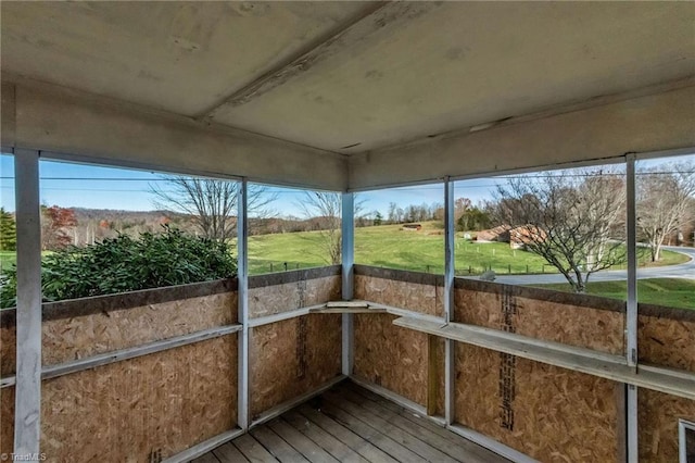 unfurnished sunroom featuring a healthy amount of sunlight