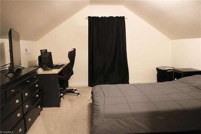 bedroom featuring light carpet, baseboards, and lofted ceiling