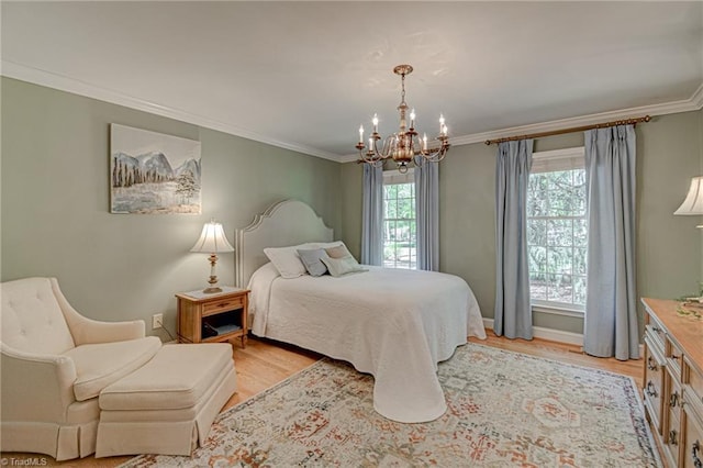 bedroom with baseboards, an inviting chandelier, ornamental molding, and light wood-style floors