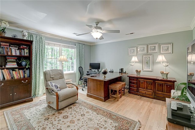 office space with ceiling fan, visible vents, ornamental molding, and light wood-style floors