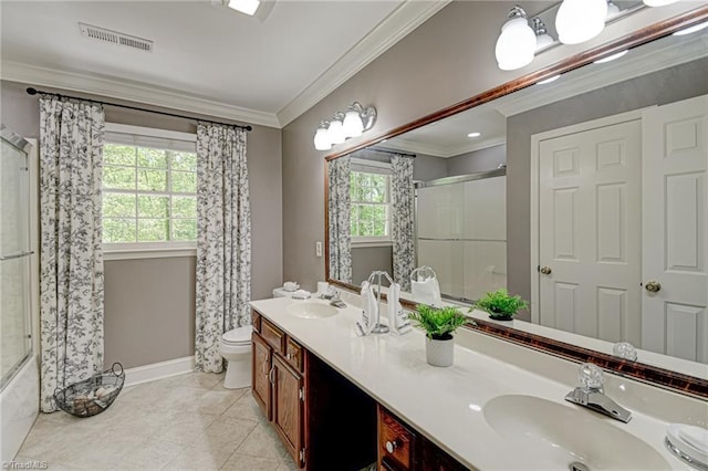 bathroom featuring visible vents, a sink, baseboards, and crown molding