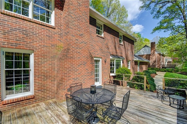 deck with outdoor dining area