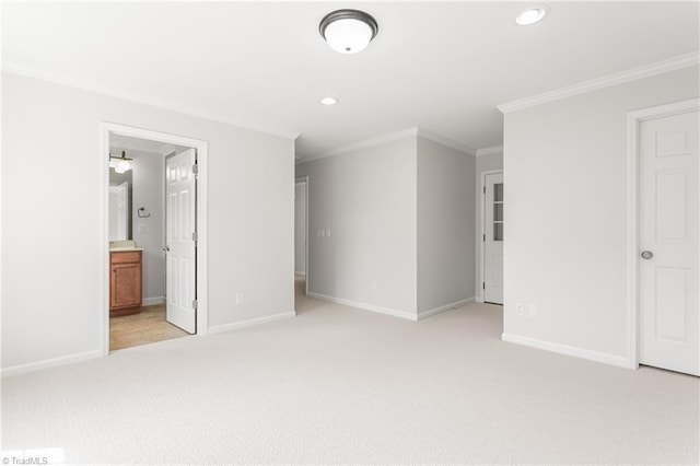 unfurnished bedroom with baseboards, ornamental molding, and light carpet