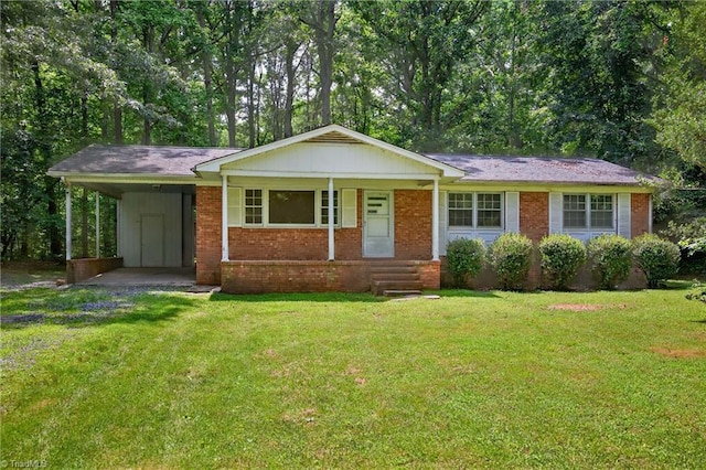 6006 Dehaven Rd, Pleasant Garden, NC 27313 - ranch-style house featuring a carport, a front yard, and brick siding