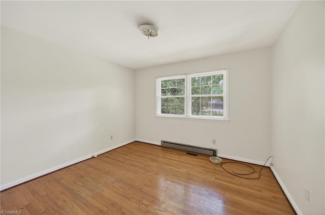 6006 Dehaven Rd, Pleasant Garden, NC 27313 - unfurnished room with baseboard heating and wood finished floors