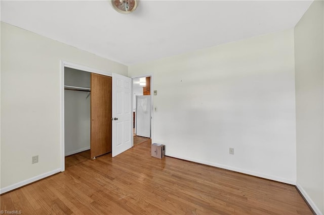 6006 Dehaven Rd, Pleasant Garden, NC 27313 - unfurnished bedroom featuring wood finished floors and a closet
