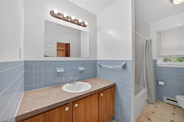 6006 Dehaven Rd, Pleasant Garden, NC 27313 - full bath featuring tile walls, vanity, tile patterned flooring, shower / bath combo with shower curtain, and baseboard heating
