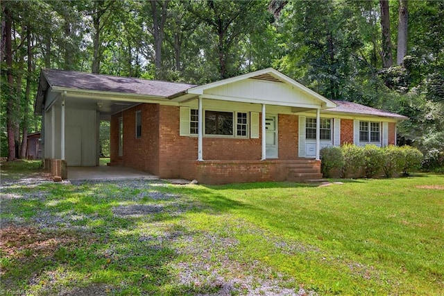 6006 Dehaven Rd, Pleasant Garden, NC 27313 - ranch-style house with a front yard, a carport, and brick siding