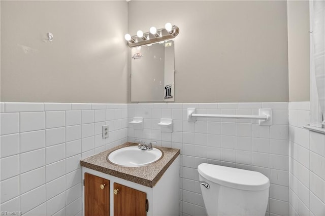 6006 Dehaven Rd, Pleasant Garden, NC 27313 - half bath with vanity, tile walls, and a wainscoted wall
