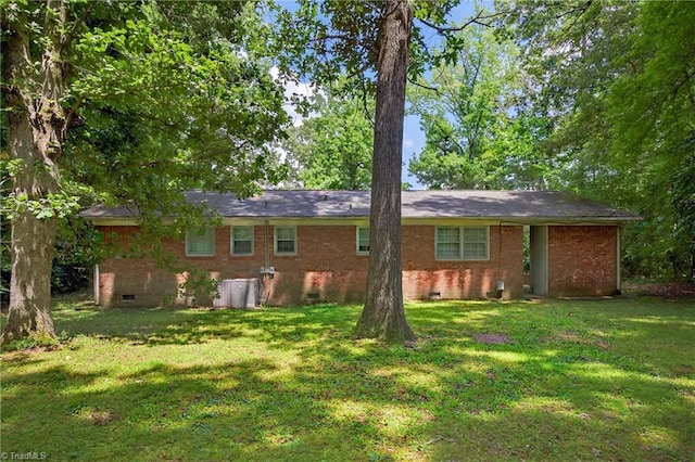 6006 Dehaven Rd, Pleasant Garden, NC 27313 - rear view of house with crawl space, a yard, and brick siding