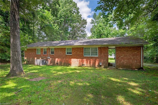 6006 Dehaven Rd, Pleasant Garden, NC 27313 - rear view of property featuring crawl space, a lawn, and brick siding
