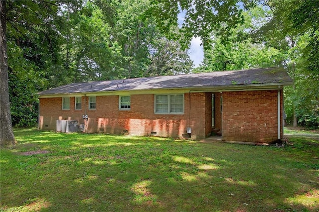 6006 Dehaven Rd, Pleasant Garden, NC 27313 - back of house featuring a lawn, crawl space, and brick siding