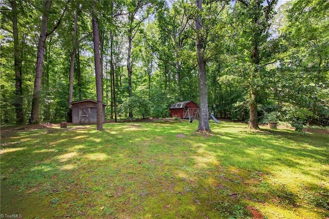6006 Dehaven Rd, Pleasant Garden, NC 27313 - view of grassy yard with a shed