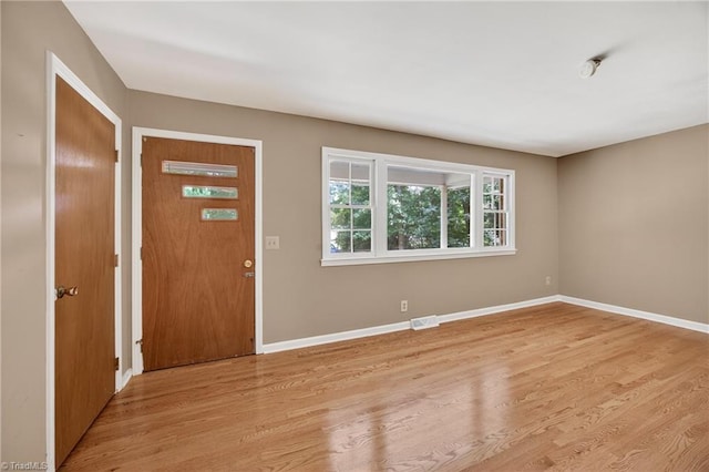 6006 Dehaven Rd, Pleasant Garden, NC 27313 - entryway with light wood-type flooring and baseboards