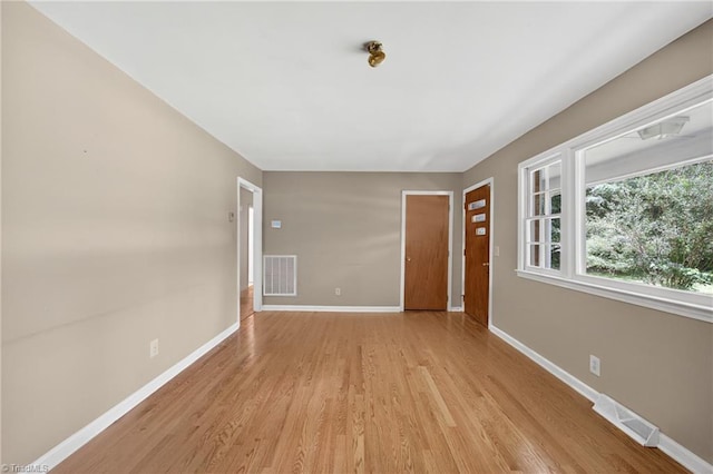 6006 Dehaven Rd, Pleasant Garden, NC 27313 - unfurnished room with light wood-type flooring and baseboards