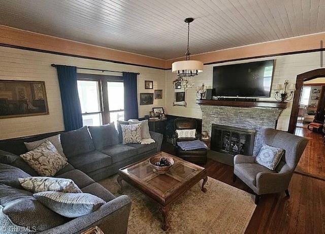 1715 Alfred Hartley Rd, Lenoir, NC 28645 - living area with wood finished floors, a fireplace, plenty of natural light, and arched walkways