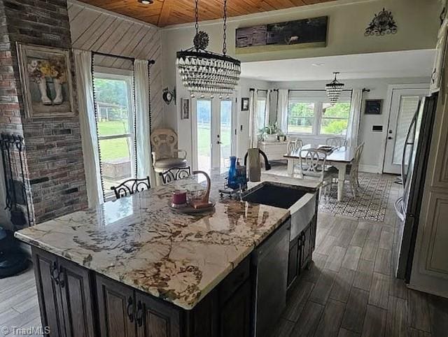 1715 Alfred Hartley Rd, Lenoir, NC 28645 - kitchen featuring stainless steel fridge, a sink, wood ceiling, an island with sink, and light stone countertops