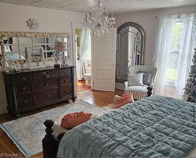1715 Alfred Hartley Rd, Lenoir, NC 28645 - bedroom featuring wood finished floors, a chandelier, and ensuite bathroom
