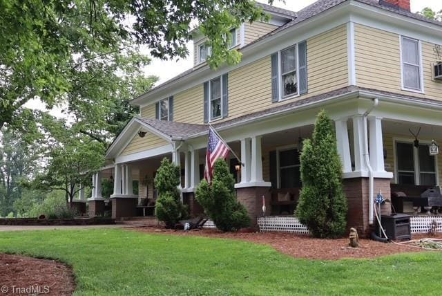 1715 Alfred Hartley Rd, Lenoir, NC 28645 - view of side of property with a porch and a yard