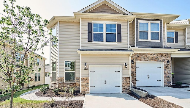 1412 Amberview Ln, Kernersville, NC 27284 - view of property with an attached garage, concrete driveway, and stone siding