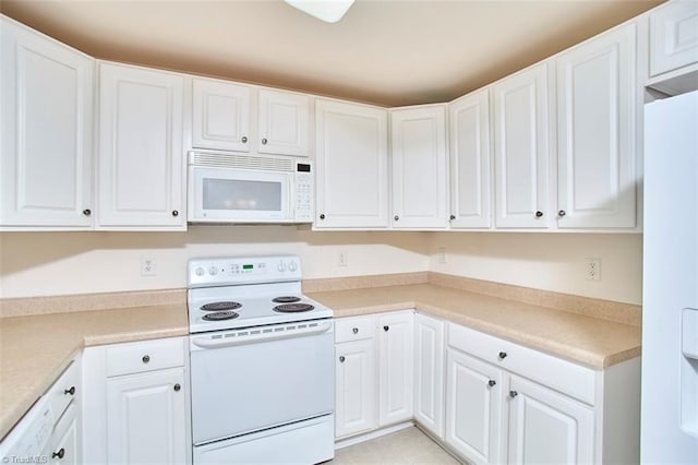 4712 Brighton Park Dr Unit 1B, Winston-Salem, NC 27103 - kitchen featuring white appliances, white cabinetry, and light countertops