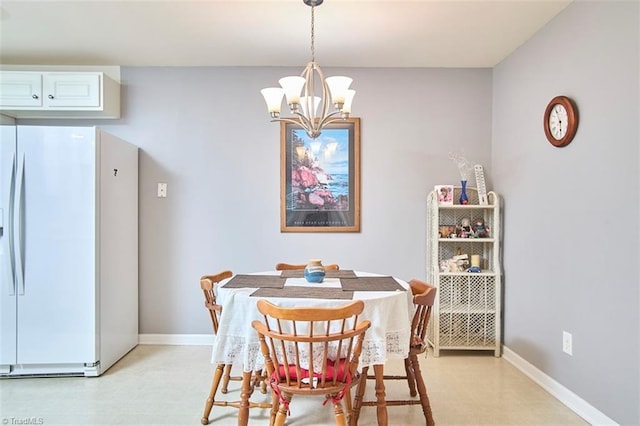 4712 Brighton Park Dr Unit 1B, Winston-Salem, NC 27103 - dining space with a chandelier, light flooring, and baseboards