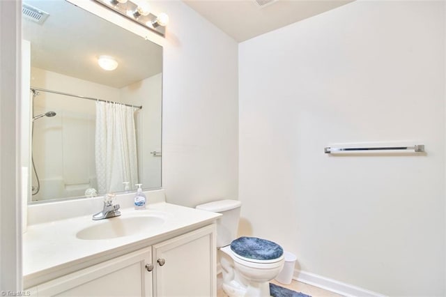 4712 Brighton Park Dr Unit 1B, Winston-Salem, NC 27103 - bathroom featuring toilet, vanity, curtained shower, baseboards, and tile patterned floors