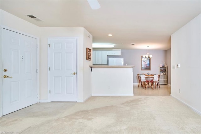 4712 Brighton Park Dr Unit 1B, Winston-Salem, NC 27103 - living area featuring light carpet, a chandelier, and baseboards