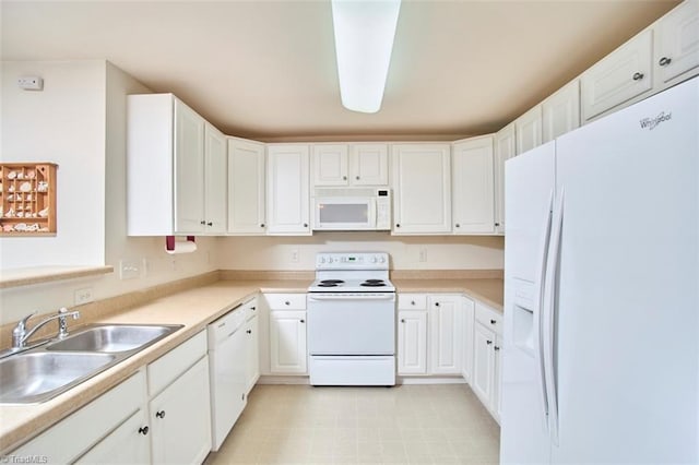 4712 Brighton Park Dr Unit 1B, Winston-Salem, NC 27103 - kitchen with white appliances, a sink, white cabinetry, and light countertops
