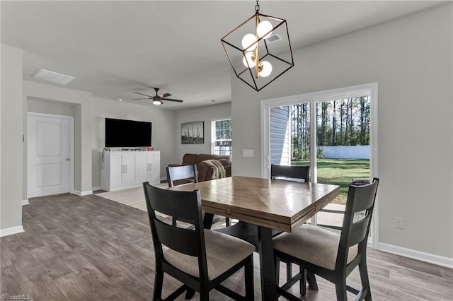 dining space featuring ceiling fan and hardwood / wood-style floors