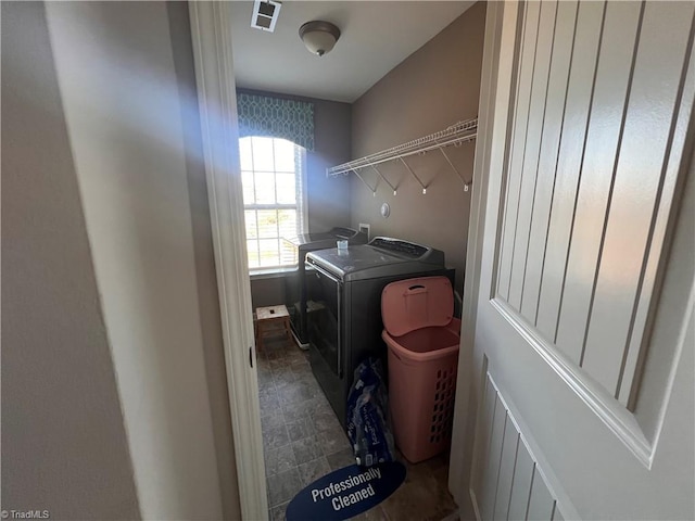 clothes washing area featuring washing machine and dryer